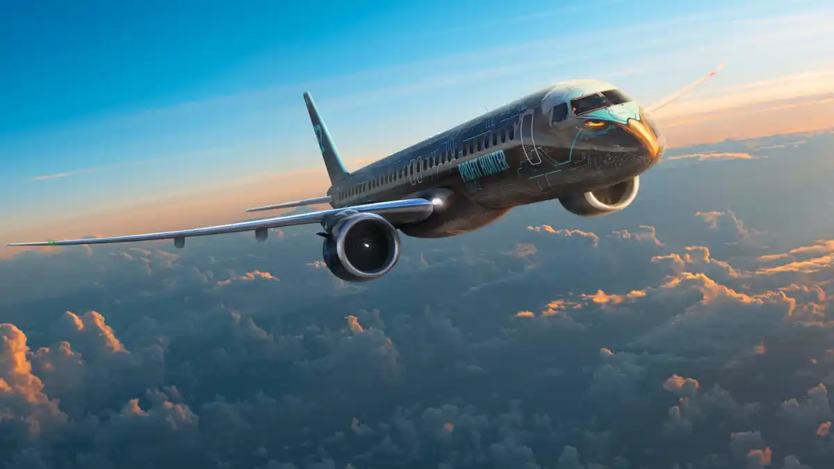 Avião comercial da Embraer (modelo E2) em voo sobre as nuvens no pôr do sol, representando a alteração do ticker para EMBJ3.