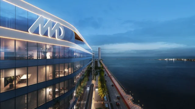 Fachada de um edifício residencial de luxo da Moura Dubeux com o logotipo "MD" iluminado no topo, representando o novo ciclo de crescimento da incorporadora em 2026.