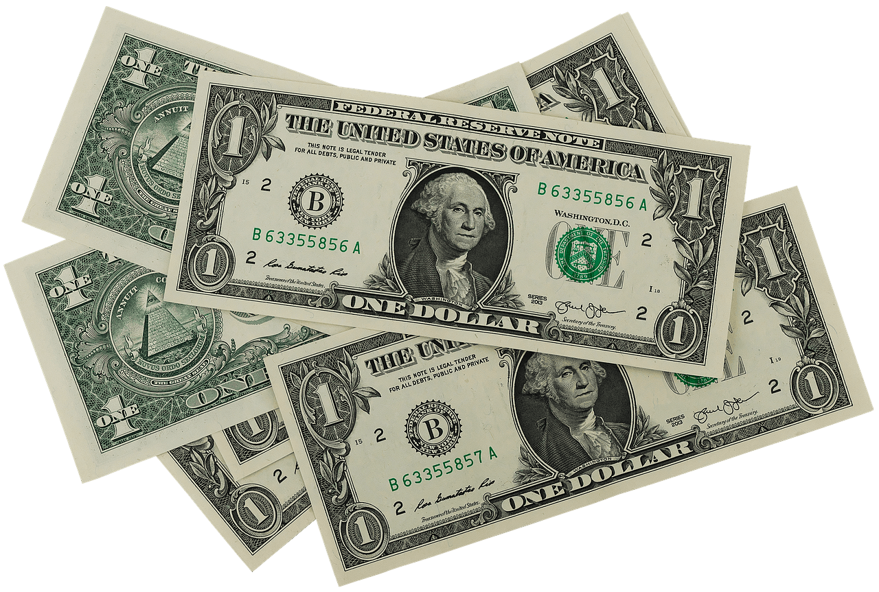 Imagem mostra várias notas de dólar sobre postas